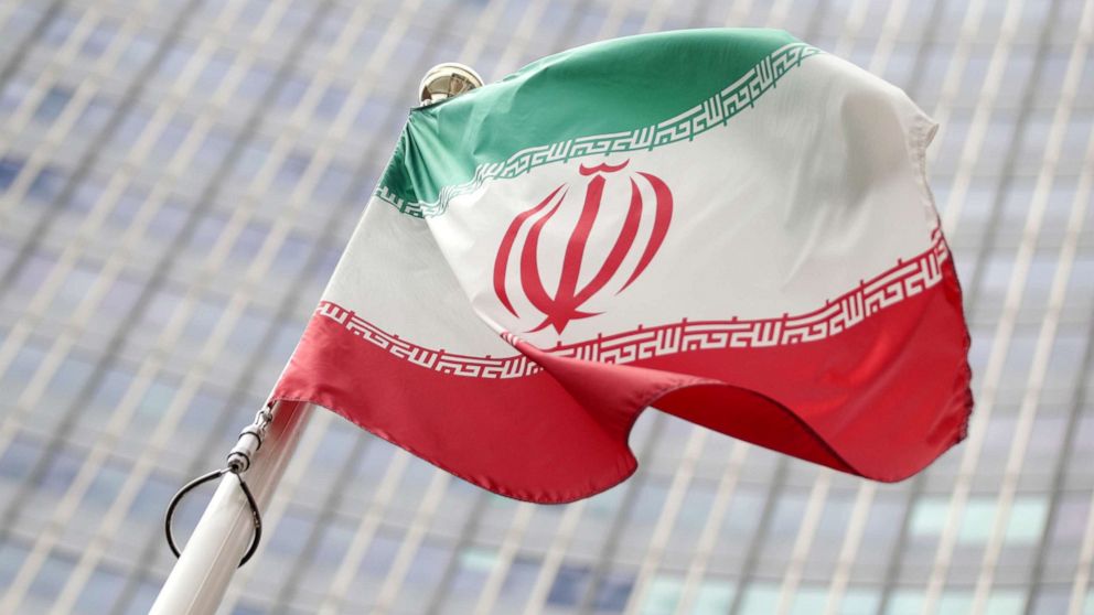 PHOTO: The Iranian flag flutters in front the International Atomic Energy Agency (IAEA) headquarters in Vienna, Austria, on Wednesday, July 10, 2019.