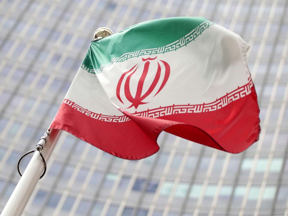 PHOTO: The Iranian flag flutters in front the International Atomic Energy Agency (IAEA) headquarters in Vienna, Austria, on Wednesday, July 10, 2019.