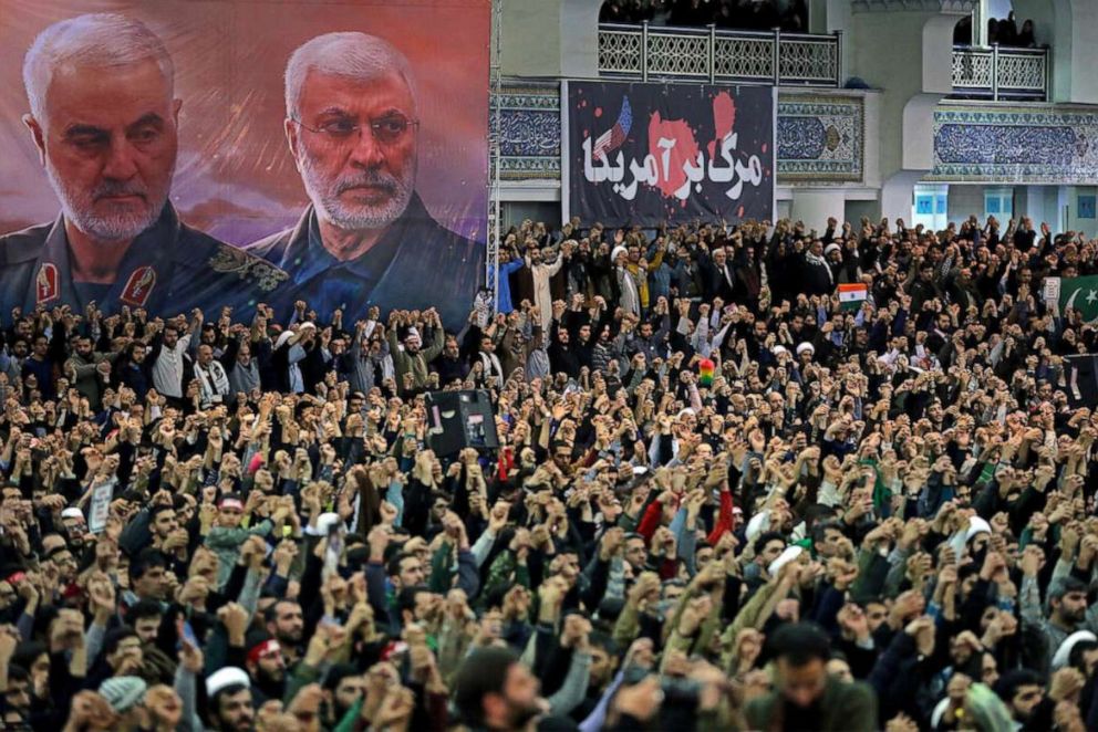 Posters show Iranian military commander Qassem Soleimani and the Iraqi militia commander Abu Mahdi al-Muhandis, both dead, as worshipers chant during a Friday prayers sermon led by Iran's Supreme Leader Ayatollah Ali Khamenei, in Tehran, Jan. 17, 2020. 