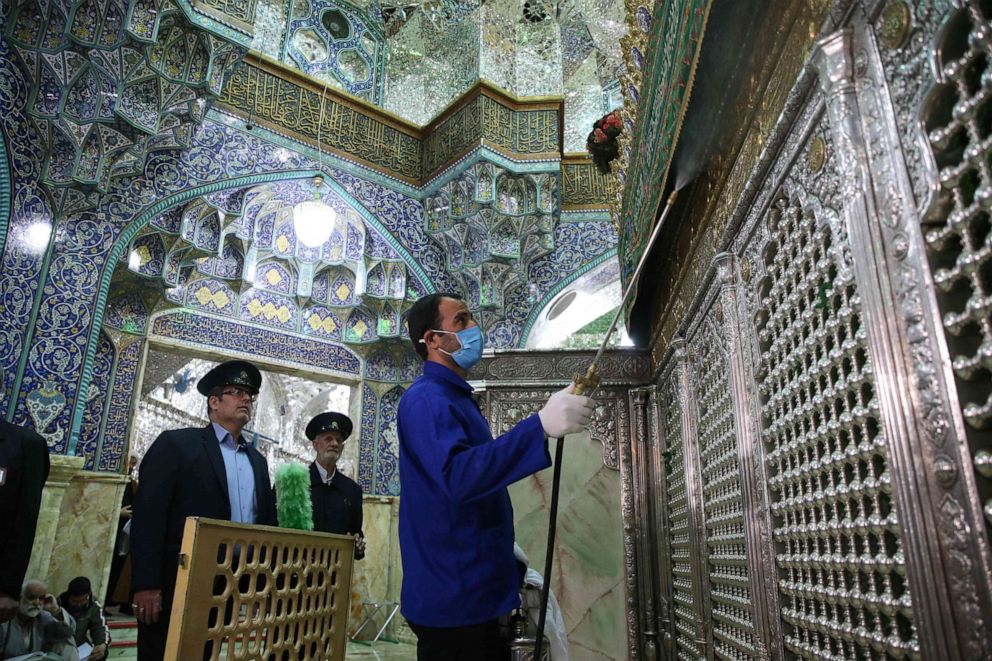 Iranian workers disinfect the Shrine of Fatima Masumeh in Qom, Iran, on February 25, 2020, to prevent the spread of the novel coronavirus which has reached the country.Mehdi Marizad/FARS NEWS AGENCY/AFP via Getty Images