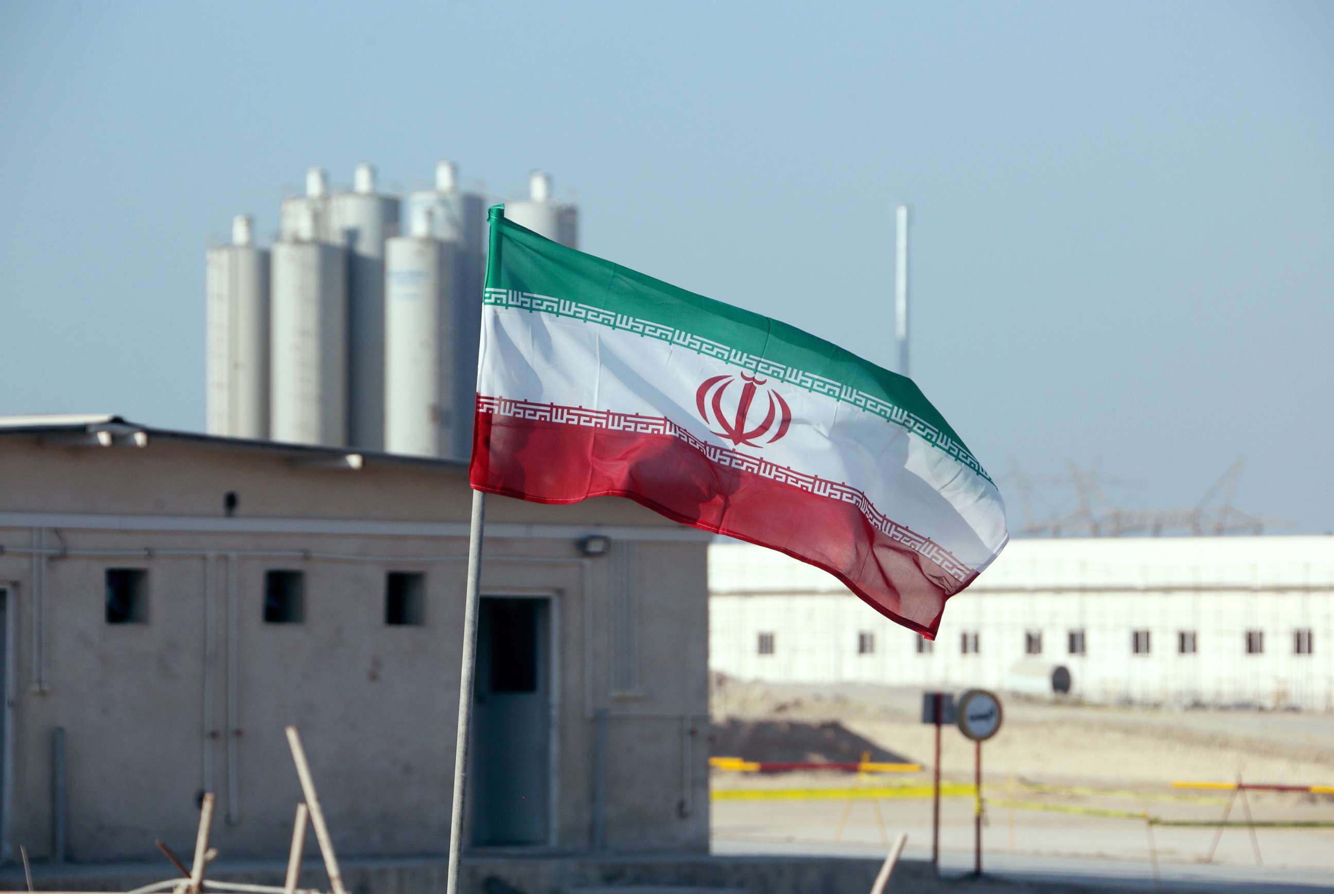 PHOTO: An Iranian flag flies over Iran's Bushehr nuclear power plant, Nov. 10, 2019, during an official ceremony to kick-start works on a second reactor at the facility.