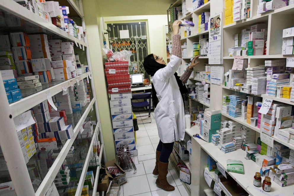 PHOTO: An Iranian pharmacist arranges medicine on shelves at a pharmacy in central Tehran, Iran, Dec. 11, 2012.