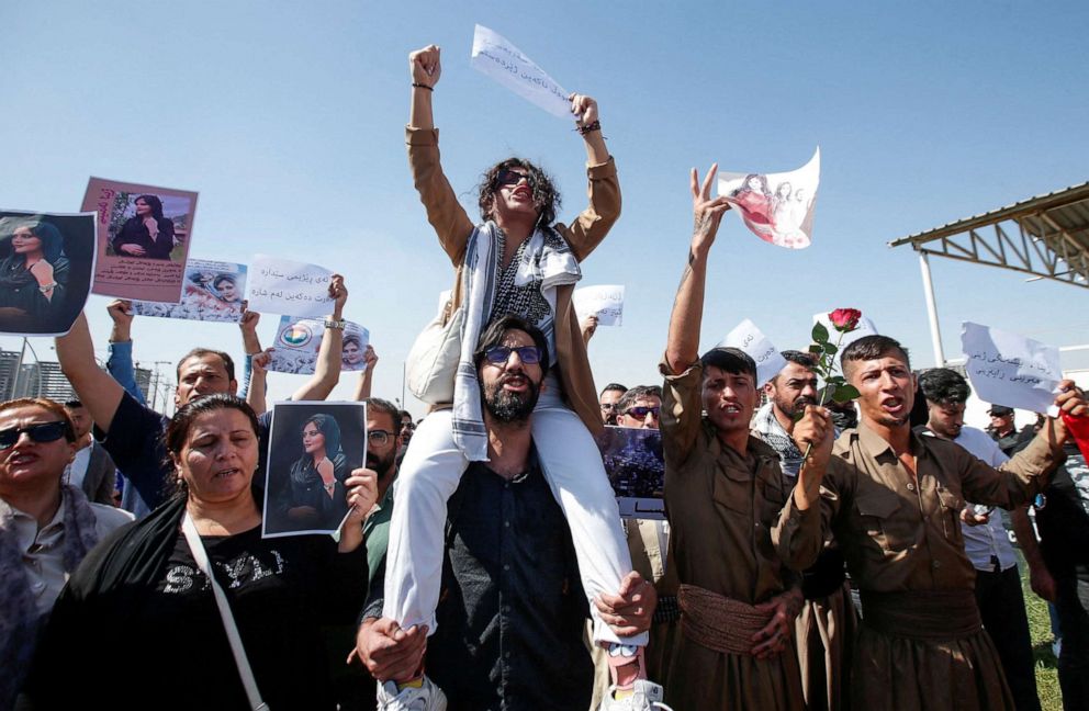 PHOTO: People take part in a protest following the death of Mahsa Amini in front of the United Nations headquarters in Erbil, Iraq, Sept. 24, 2022.