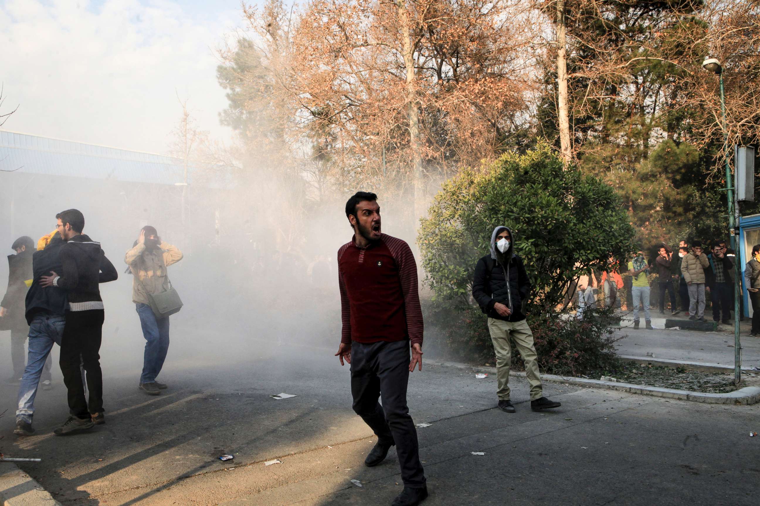 PHOTO: University students attend a protest inside Tehran University while a smoke grenade is thrown by anti-riot Iranian police, in Tehran, Iran, Dec. 30, 2017, in a photo obtained by AP.