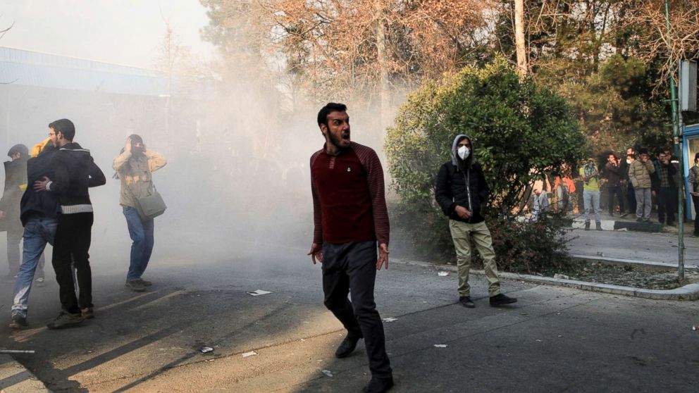 PHOTO: University students attend a protest inside Tehran University while a smoke grenade is thrown by anti-riot Iranian police, in Tehran, Iran, Dec. 30, 2017, in a photo obtained by AP.