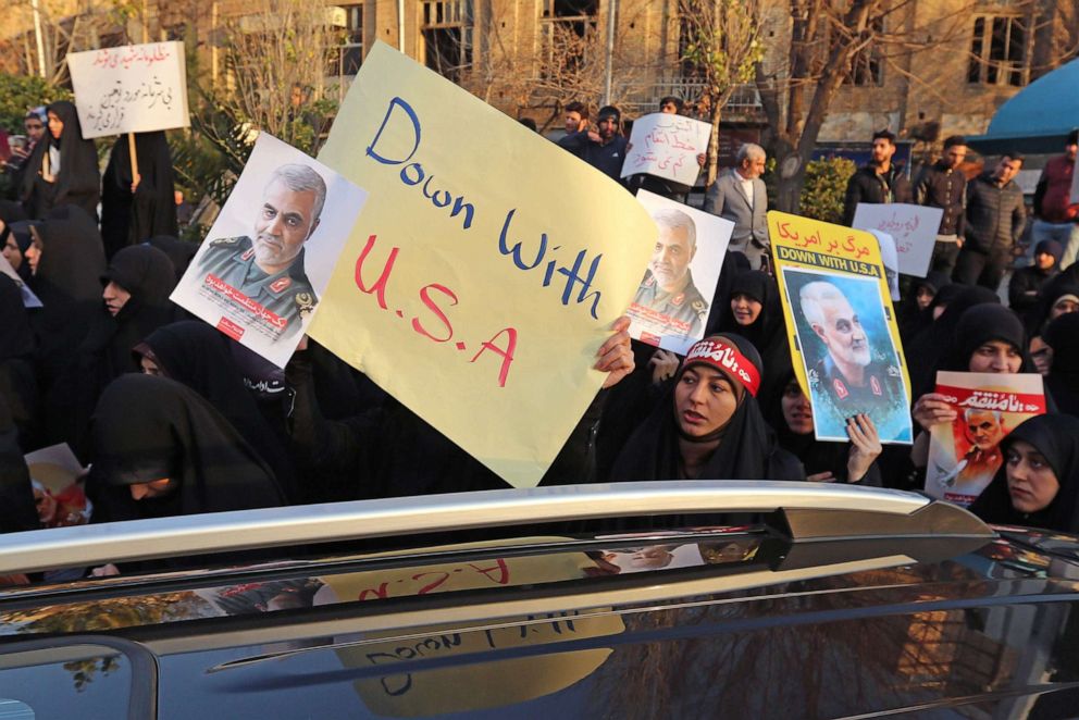 PHOTO: Iranian demonstrators hold placards bearing the image of slain military commander Qassem Soleimani in front of the British embassy in Tehran, Janu. 12, 2020 following the British ambassador's arrest for allegedly attending an illegal demonstration.