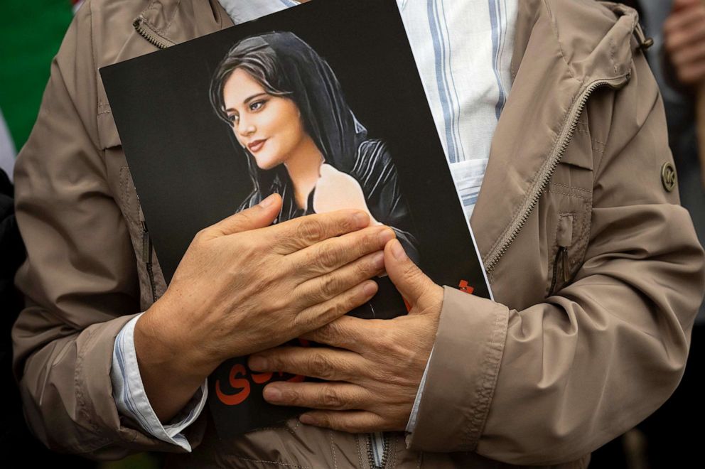PHOTO: FILE - A portrait of Mahsa Amini is held during a rally calling for regime change in Iran following the death of Amini, a young woman who died after being arrested in Tehran by Iran's notorious "morality police," in Washington, Oct. 1, 2022.