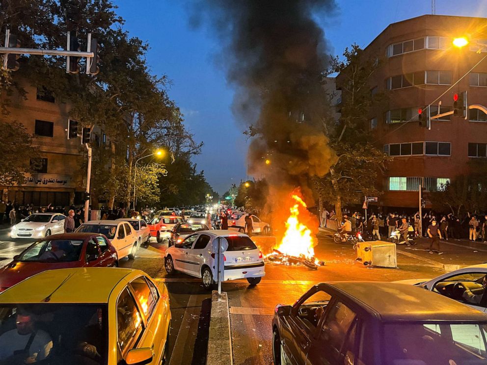 PHOTO: FILE - A police motorcycle burns during a protest over the death of Mahsa Amini, a woman who died after being arrested by the Islamic republic's "morality police", in Tehran, Iran, Sept. 19, 2022.