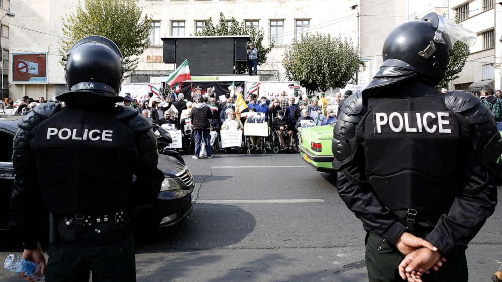 PHOTO: Iranian anti-riot police forces keep watch as protesters gather in front of the German embassy in Tehran, Iran, Nov. 1, 2022.