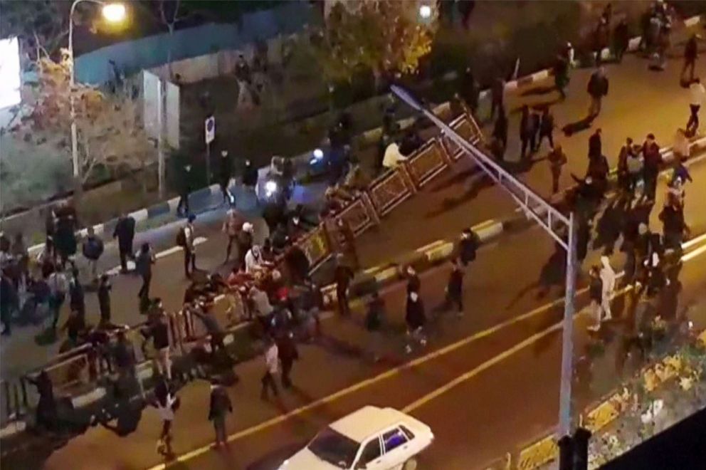 PHOTO: A group of people pull down at a fence in a street during protests in Tehran, Iran, Dec. 30, 2017, in an image taken from video released by Iran's Mehr News agency.