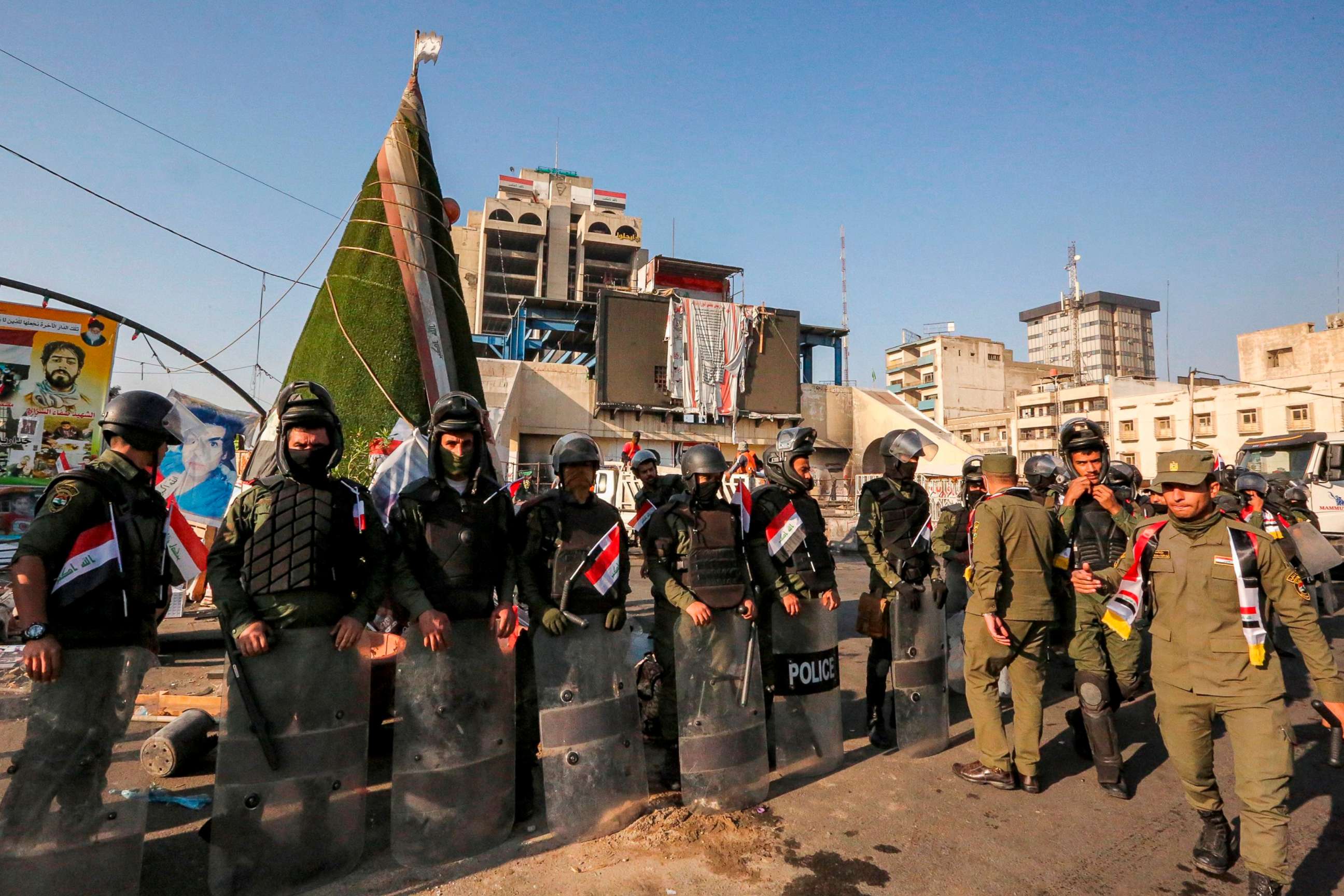 PHOTO: Members of the Iraqi security forces stand guard during the reopening of the Iraqi capital Baghdad's central Tahrir Square on October 31, 2020. 