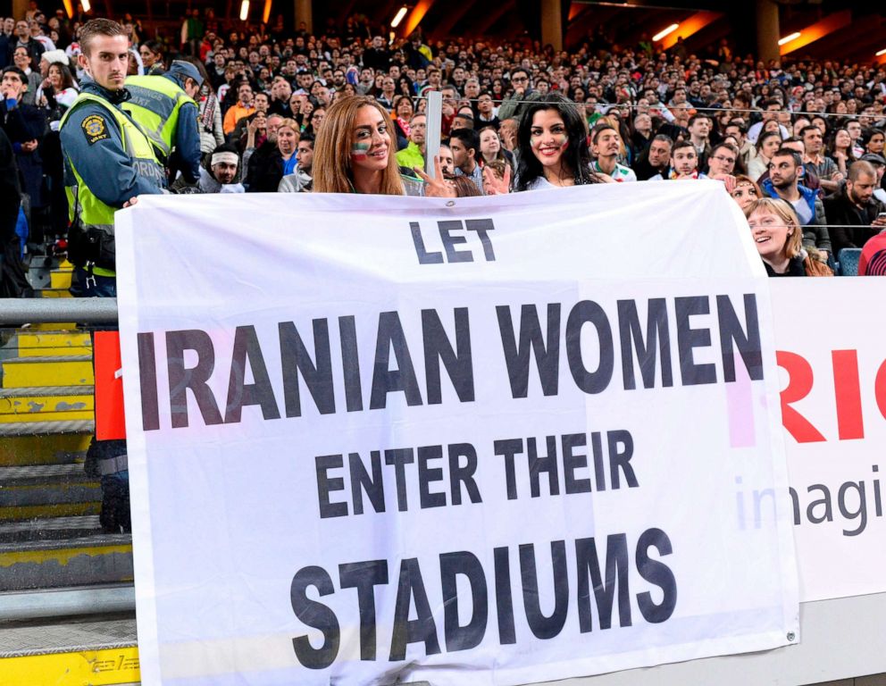 PHOTO: Supporters hold a banner reading "Let Iranian women enter their stadiums" during the friendly international match between Sweden and Iran at the Friends Arena near Stockholm.