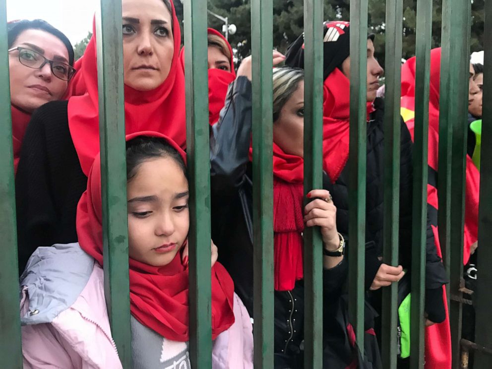 PHOTO: Iranian women wait behind the gates of Tehran's Azadi Stadium trying to convince security officers to let them in, Nov. 10, 2018.