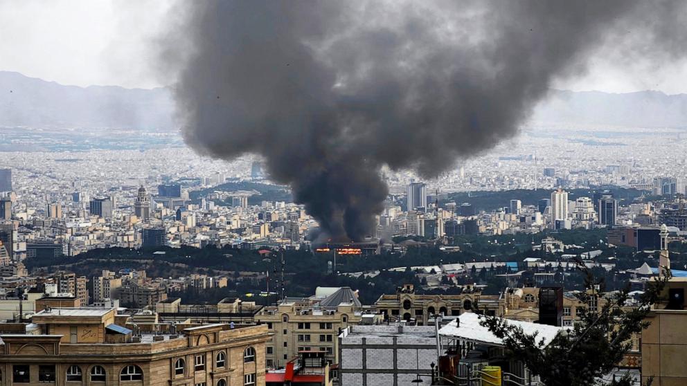 PHOTO: Smoke rises after a reported Israeli strike on a building used by Islamic Republic of Iran News Network, part of Iran's state TV broadcaster, on June 16, 2025 in Tehran, Iran.