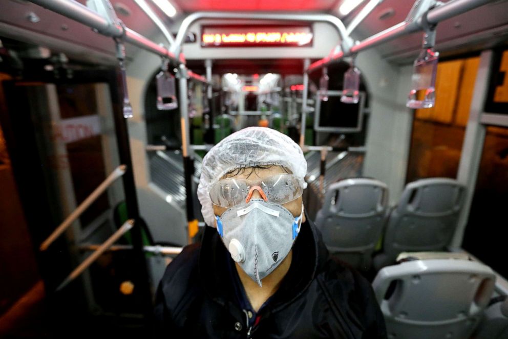 PHOTO: A Tehran Municipality worker cleans a bus to avoid the spread of the novel coronavirus in Tehran, Iran, on Feb. 26, 2020.