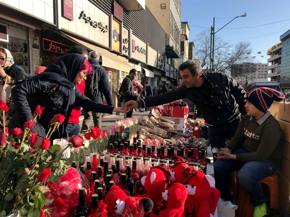 PHOTO: A woman buys a Valentine's Day gift in Tehran, Iran, Feb. 13, 2020.