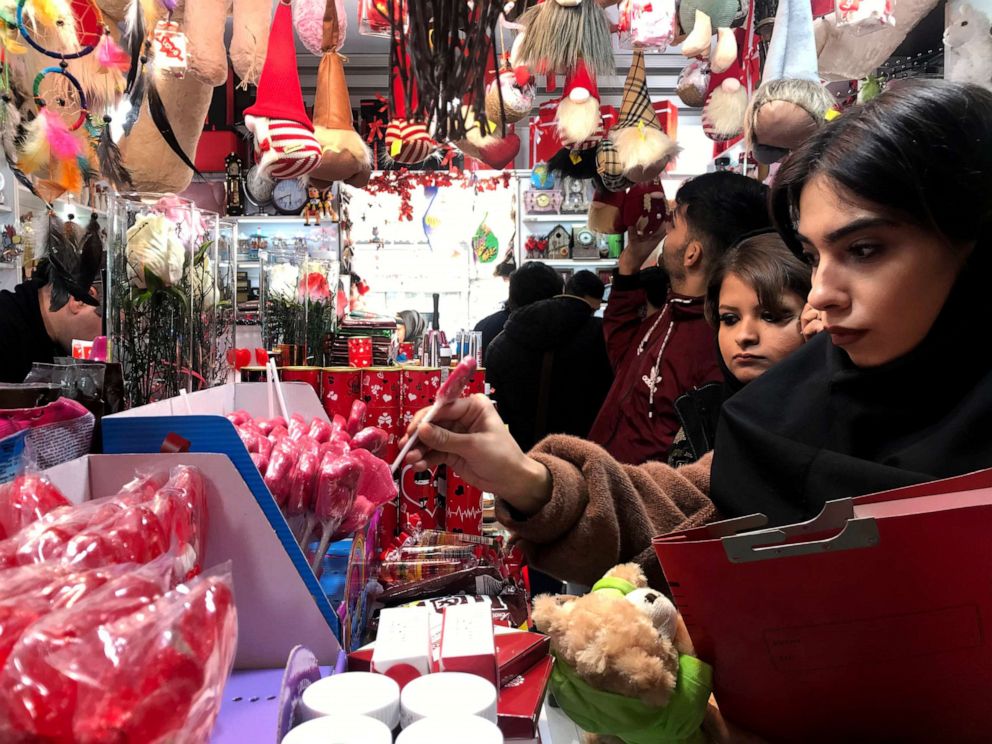 PHOTO: A young woman shops for Valentine's Day candy at a gift shop in Tehran, Iran, Feb. 13, 2020.