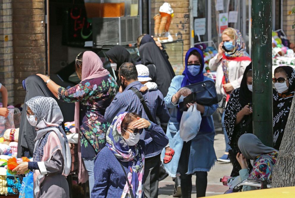 PHOTO: Iranian women, wearing protective masks due to the COVID-19 pandemic, shop in the capital Tehran on August 4, 2020. 