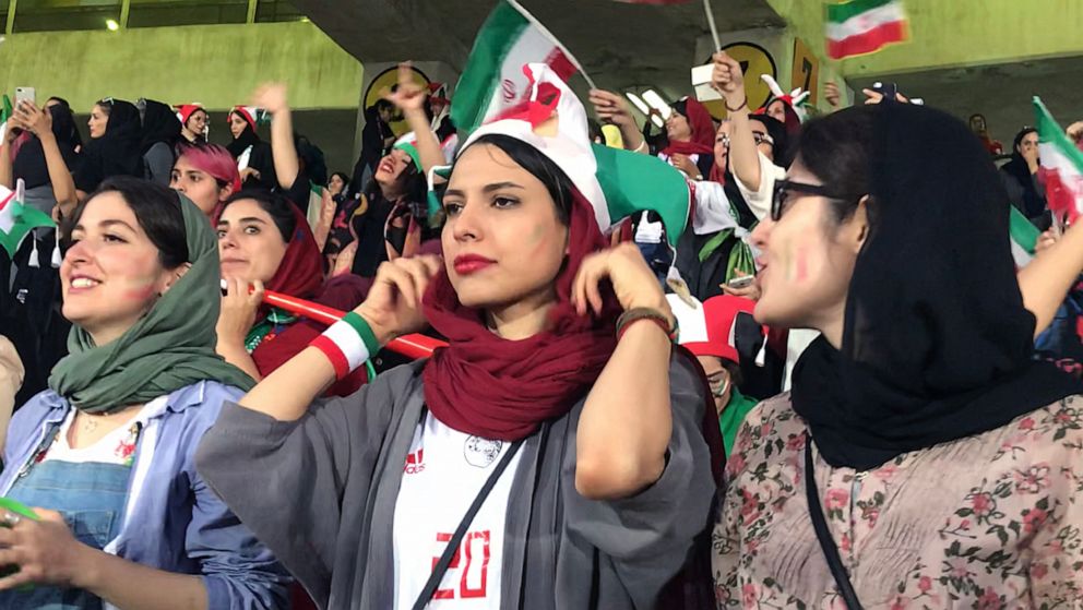 PHOTO: Zahra Ahooei, 30, center, watches the World Cup qualifying match between Iran and Cambodia at Azadi Stadium in Tehran, Iran, Oct. 10, 2019.