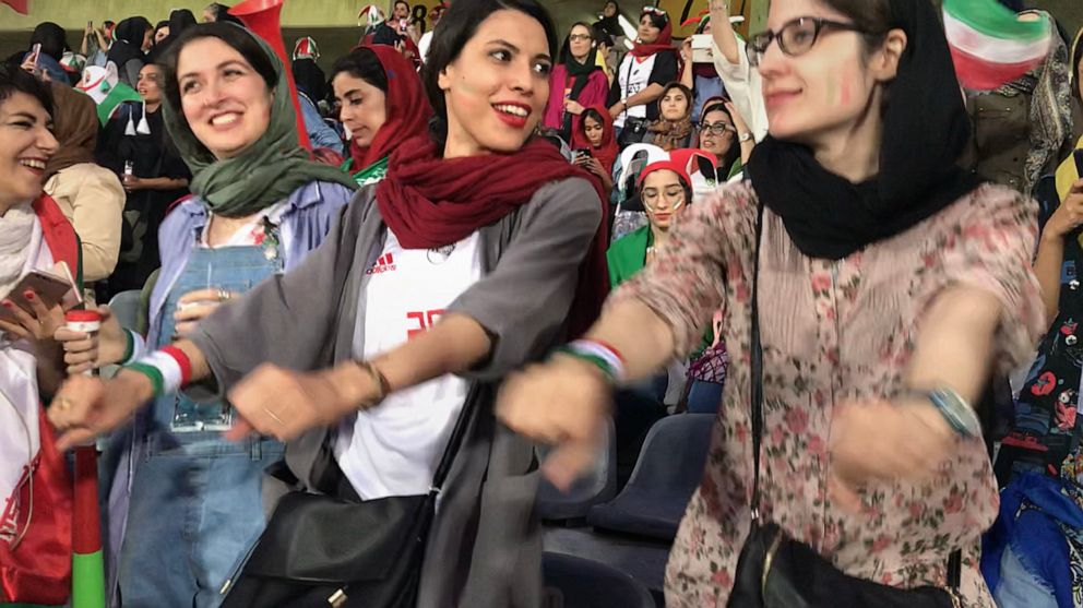 PHOTO: Zahra Ahooei, 30, dances to the music during half time of the World Cup qualifying match between Iran and Cambodia at Azadi Stadium in Tehran, Iran, Oct. 10, 2019.