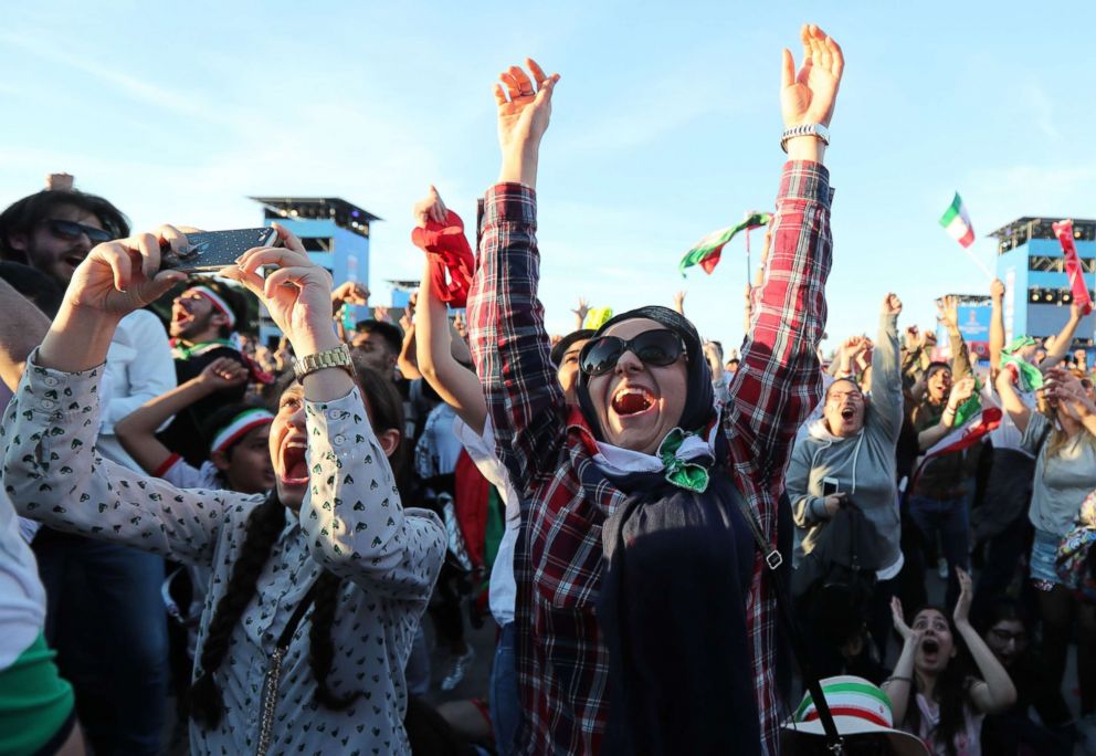 PHOTO: Fans of Iran celebrate after the FIFA World Cup 2018 group B preliminary round soccer match between Morocco and Iran, in which Iran beat Morocco, at the FIFA fan zone in Moscow, June 15, 2018.