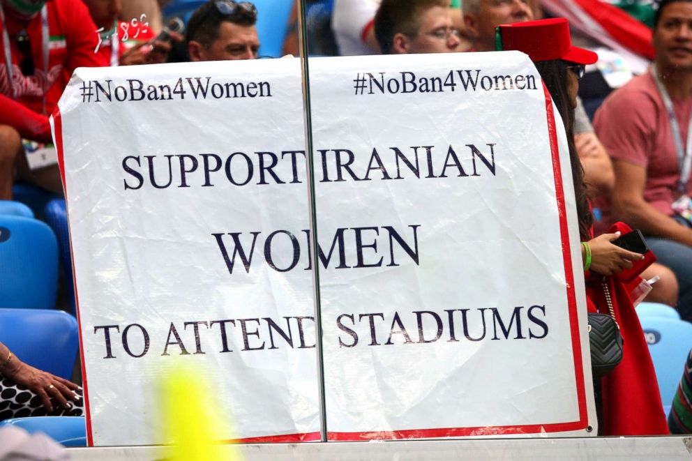 PHOTO: A sign is held by fans in support of Iranian women in football during the 2018 FIFA World Cup Russia group B match between Morocco and Iran at Saint Petersburg Stadium, June 15, 2018, in Saint Petersburg, Russia.