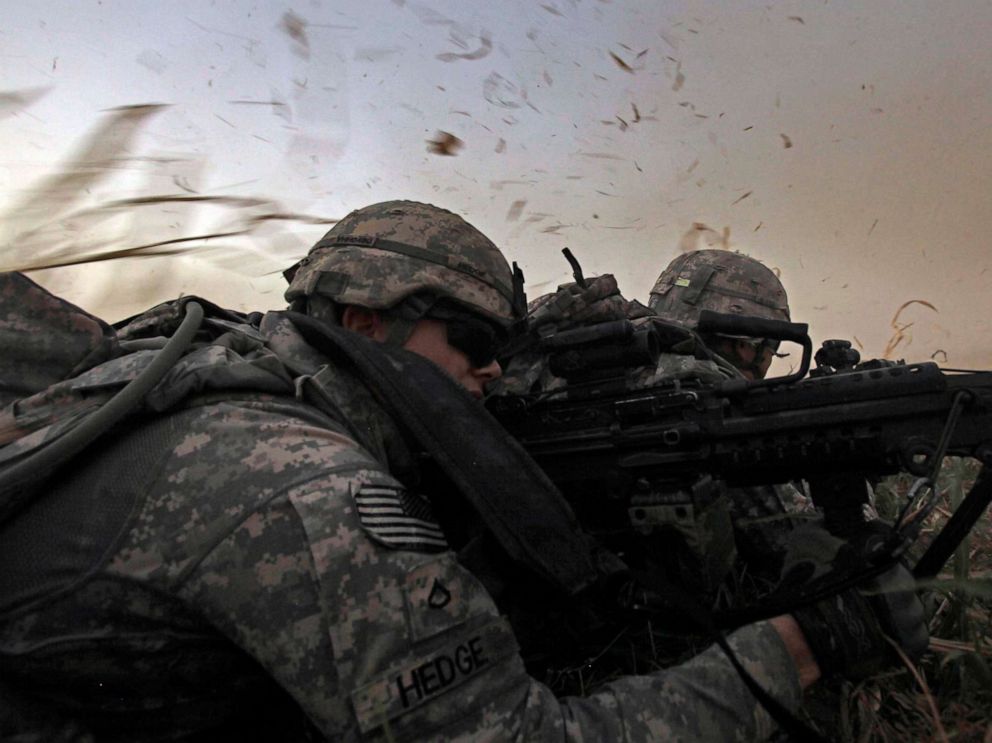 PHOTO: David Hedge from Bealeton, Va., front, and fellow soldiers from 1st Battalion, 18th Infantry Regiment are bathed in rotor wash moments after arriving by Blackhawk helicopter north of Baghdad, Iraq