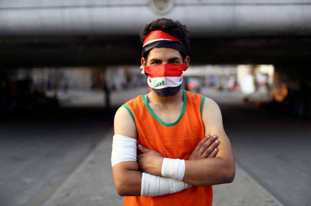 PHOTO: Mohammad, an Iraqi demonstrator, poses for a photograph during the ongoing anti-government protests in Baghdad, Iraq, November 12, 2019.