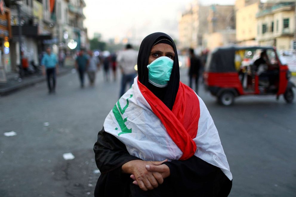 PHOTO: Salwa Hussein, an Iraqi woman demonstrator, poses for a photograph during the ongoing anti-government protests in Baghdad, Iraq, November 11, 2019.