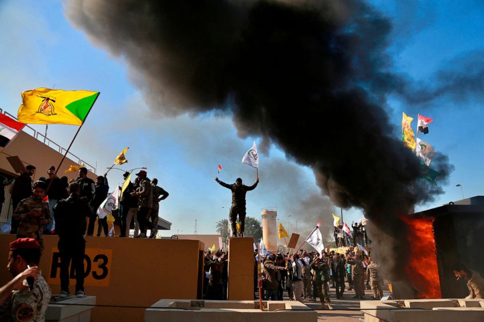 PHOTO: Protesters burn property in front of the U.S. embassy compound, in Baghdad, Dec. 31, 2019.