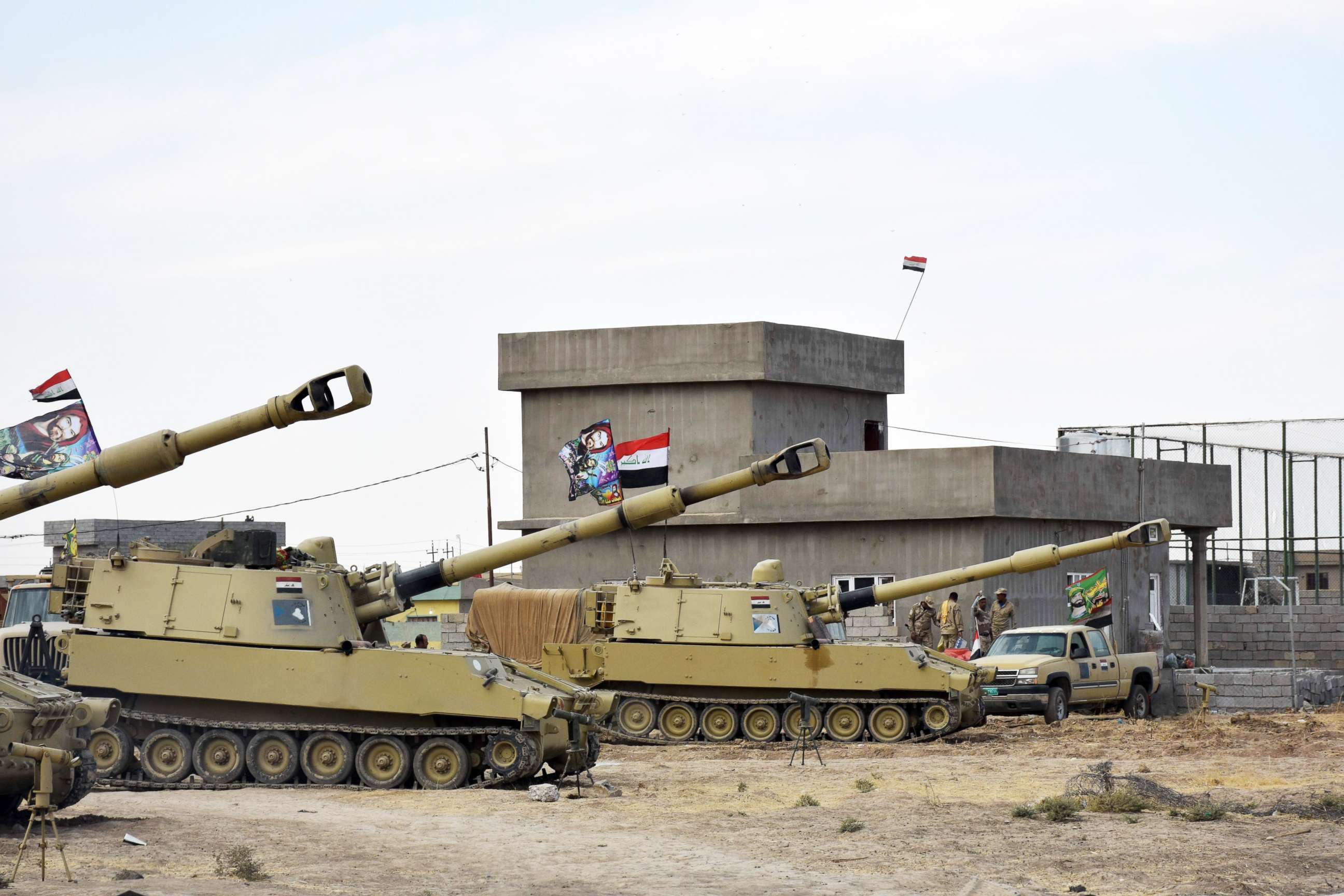 PHOTO: Iraqi army vehicles are seen parked near a former Kurdish military position on Oct. 13, 2017, in the northern Iraqi town of Tuz Khurmatu, near Kirkuk.
