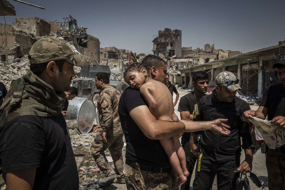 PHOTO: An unidentified young boy, who was carried out of the last ISIS controlled area in the Old City by a man suspected of being a militant, that is cared for by Iraqi Special Forces soldiers in Mosul, Iraq, July 12, 2017.