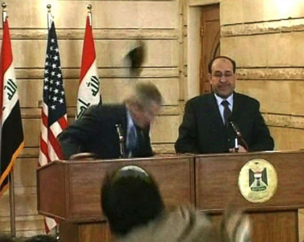 PHOTO: In this image from APTN video,  Muntazar al-Zaidi, foreground, throws a shoe at President George W. Bush, who ducks, during a news conference with Iraq Prime Minister Nouri al-Maliki, Dec. 14, 2008, in Baghdad. 