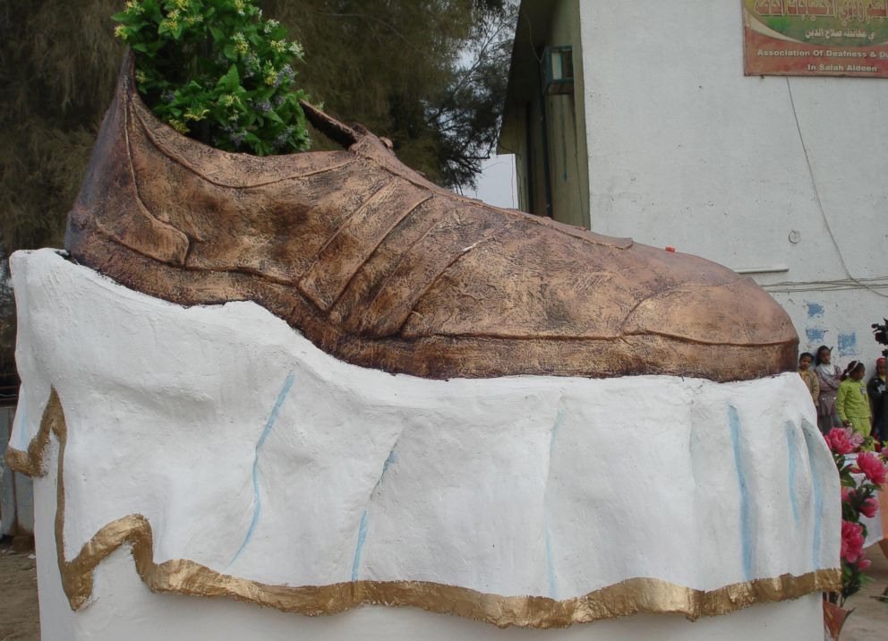 PHOTO: A bronze sculpture honoring the shoes of Iraqi reporter Muntazer al-Zaidi, who gained global fame by throwing his footwear at former President George W. Bush, stands atop a white pedestal during an unveiling ceremony on Jan. 27, 2009.