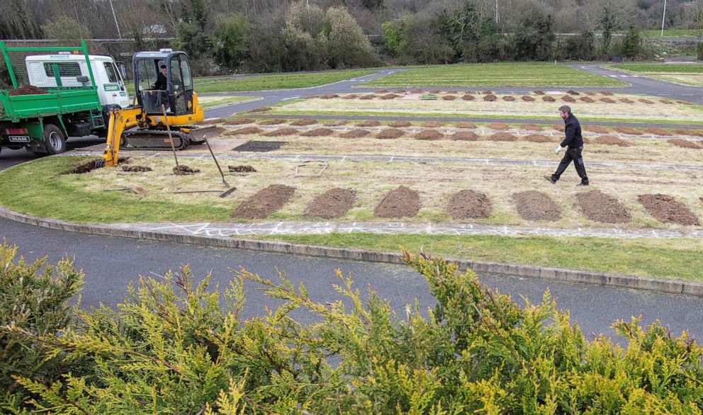 PHOTO: Workmen pre-dig graves at Sixmile Cemetery in Antrim, near Belfast, in Northern Ireland on April 2, 2020, as life in the United Kingdom continues during the nationwide lockdown to combat the novel coronavirus COVID-19 pandemic.