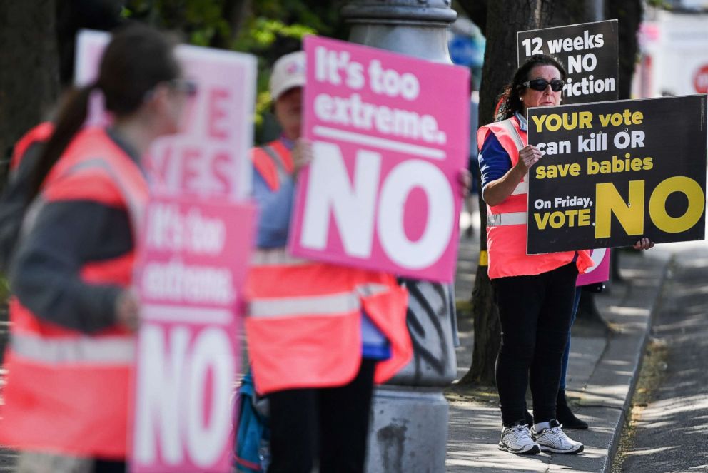 PHOTO: Members of the public hold 'no' placards as the country heads to the polls, May 25, 2018 in Dublin, Ireland.