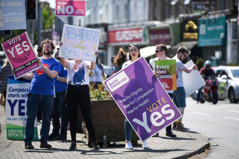 PHOTO: People hold 'yes' placards as the country heads to  polling stations, May 25, 2018 in Dublin, Ireland. Voters will decide whether or not to abolish the 8th amendment which makes abortions illegal, except when the mother's life is at risk.