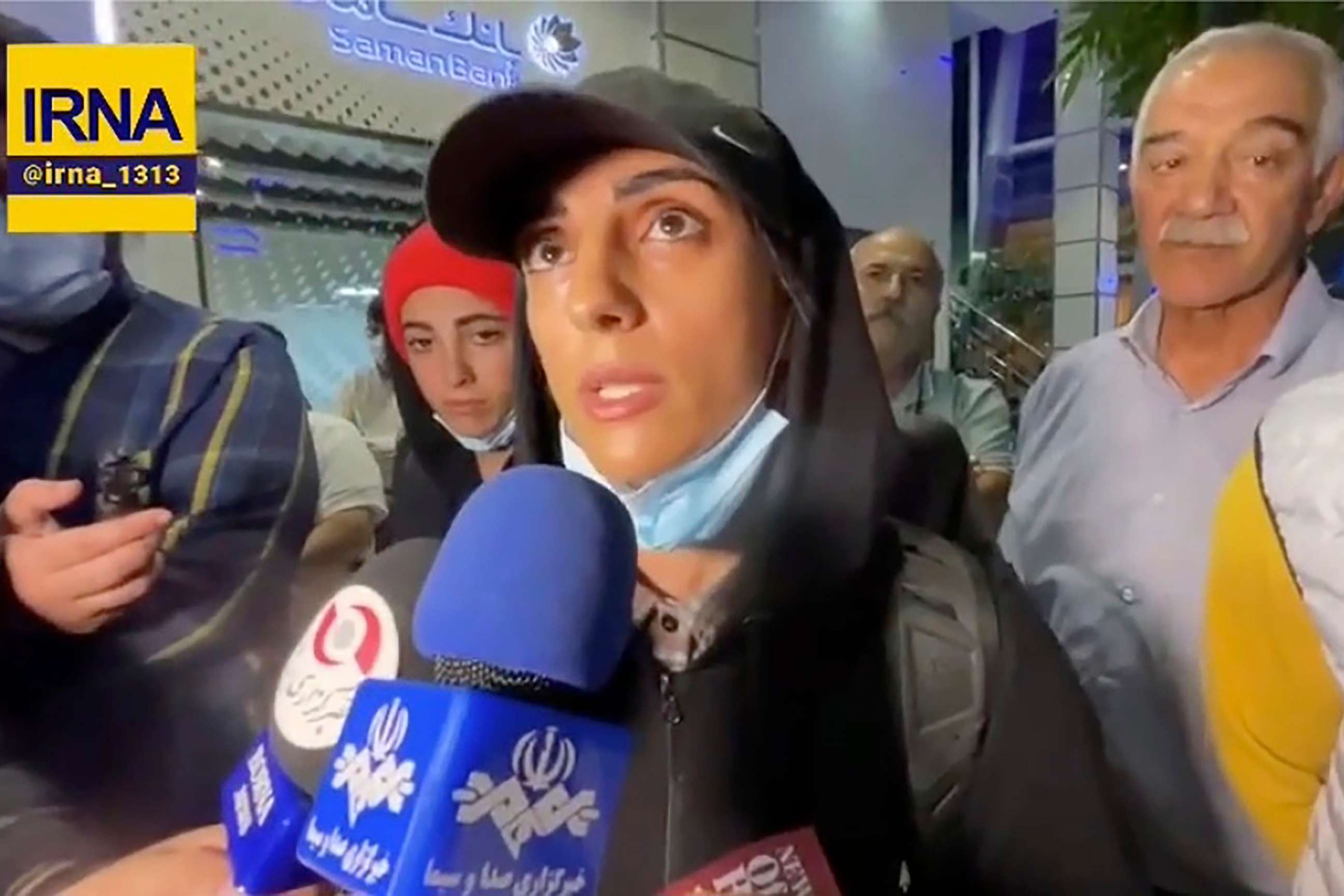 PHOTO: In this image taken from video by Iran's state-run IRNA news agency, Iranian sport climber Elnaz Rekabi speaks to journalists at Imam Khomeini International Airport in Tehran, Iran, on Oct. 19, 2022.