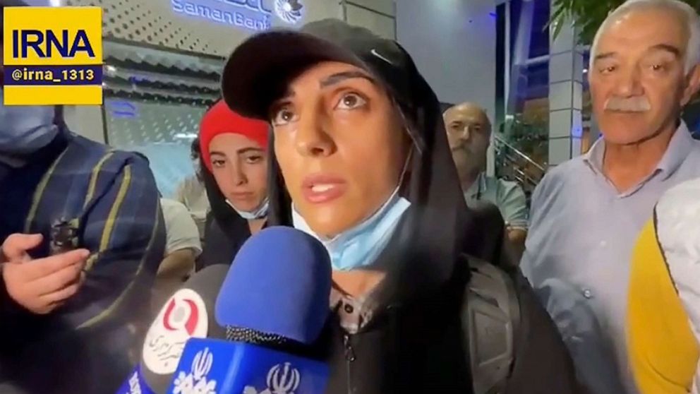 PHOTO: In this image taken from video by Iran's state-run IRNA news agency, Iranian sport climber Elnaz Rekabi speaks to journalists at Imam Khomeini International Airport in Tehran, Iran, on Oct. 19, 2022.