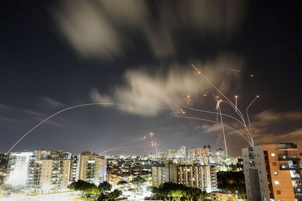 PHOTO: Streaks of light are seen as Israel's Iron Dome anti-missile system intercepts rockets launched from the Gaza Strip towards Israel, as seen from Ashkelon, Israel, May 12, 2021.