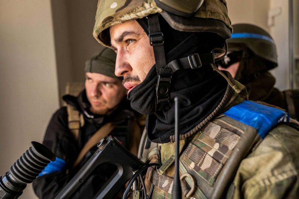 PHOTO: A soldier fighting for Ukraine watches for movement outside during a clearing-out operation of remaining Russian forces in Irpin, Ukraine, on March 29, 2022. The Ukrainian unit has essentially retaken, for now, the suburb just west of Kyiv.