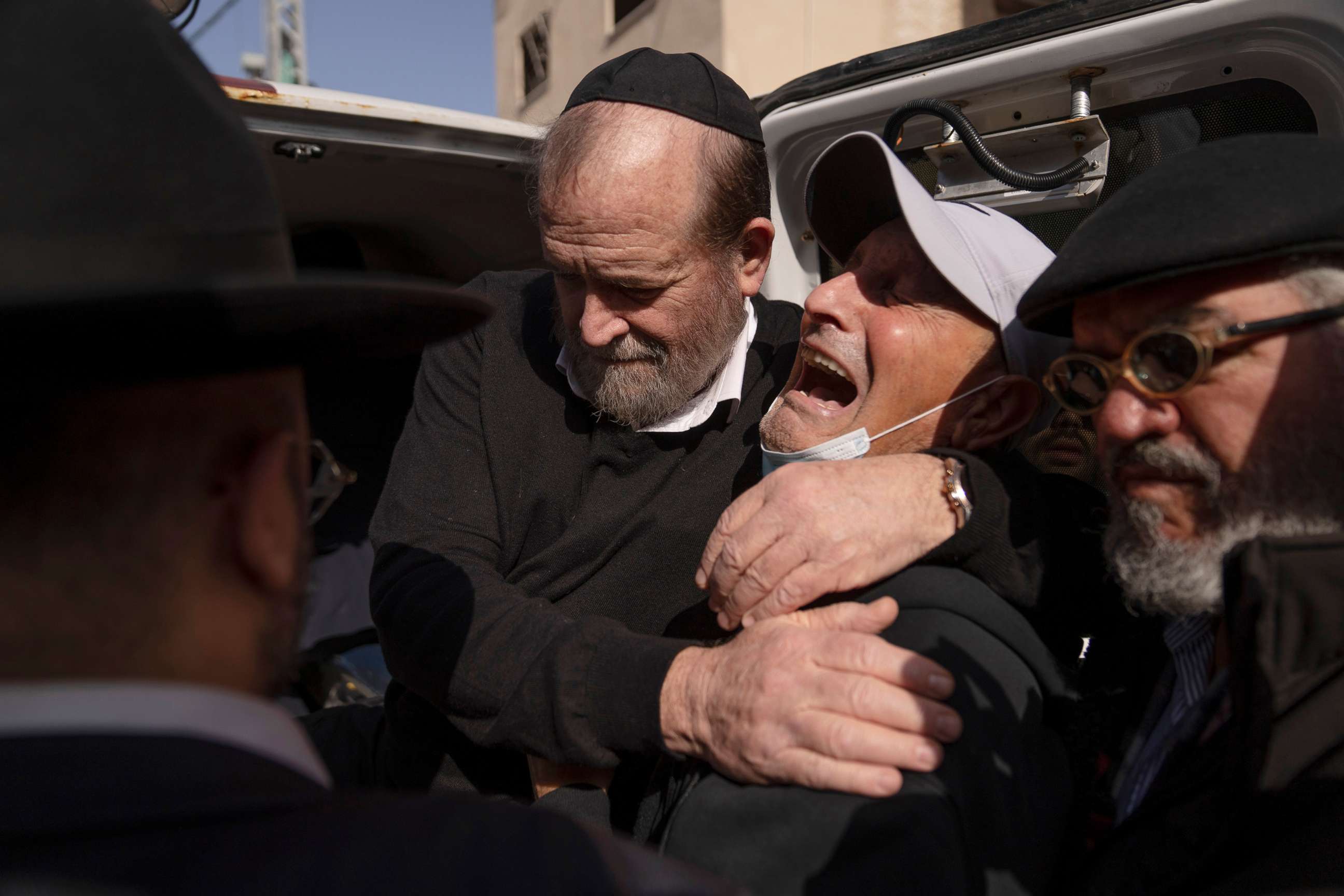 PHOTO: Mourners attend the funeral of Avishai Yehezkel, 29, in Bnei Brak Israel, March 30, 2022. Yehezkel was one of five killed by a gunman in a crowded city in central Israel late March 29, the second mass shooting rampage this week.