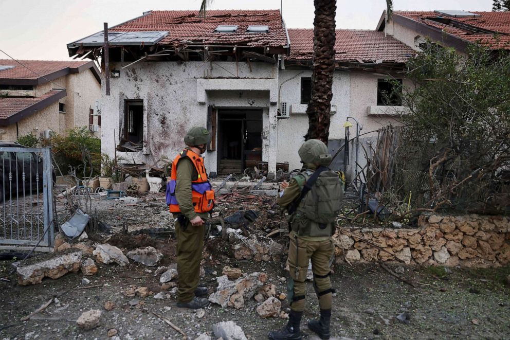 PHOTO: Israeli troops inspect a damaged house in the southern Israeli city of Ashkelon after a rocket attack from Gaza on Oct. 9, 2023.