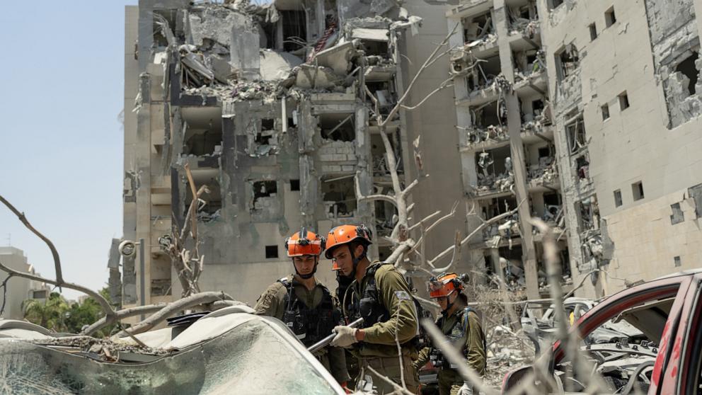 PHOTO: Emergency responders work at a building where four people were killed by an Iranian missile strike on June 24, 2025 in Beersheba, Israel.