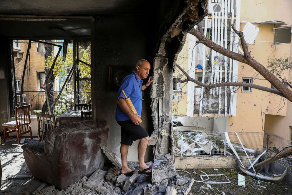 PHOTO: A member of Sror family inspect the damage of their apartment after being hit by a rocket fired from the Gaza Strip over night, in Petah Tikva, central Israel, May 13, 2021.