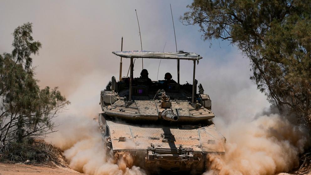 PHOTO: Israeli soldiers drive a tank near the Israeli-Gaza border, in southern Israel, May 29, 2024. 