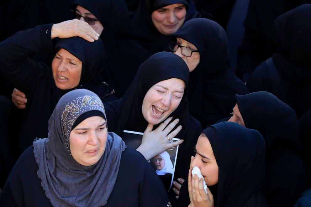PHOTO: Relatives of the victims who were killed by an Israeli airstrike, mourn during their funeral procession in the town of Blida, a Lebanese border village with Israel in south Lebanon, Nov. 7, 2023.