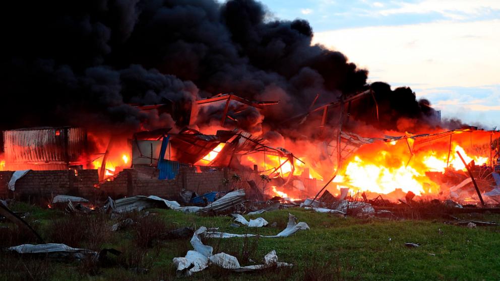 PHOTO: Black smoke and flames rise from a burning warehouse, attacked by Israeli strikes, at an industrial district, in the southern coastal town of Ghazieh, Lebanon, Feb. 19, 2024. 