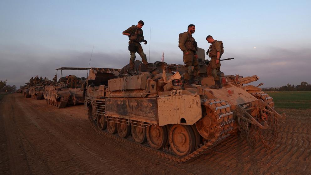 PHOTO: Israeli soldiers aboard military vehicles at an area near the Israeli-Gaza border in southern Israel, Dec. 25, 2023.