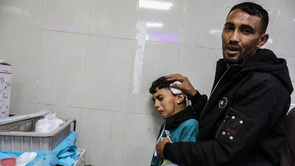 PHOTO: Palestinians injured in an Israeli airstrike arrive at Nasser Medical Hospital, December 8, 2023, in Khan Yunis, Gaza.